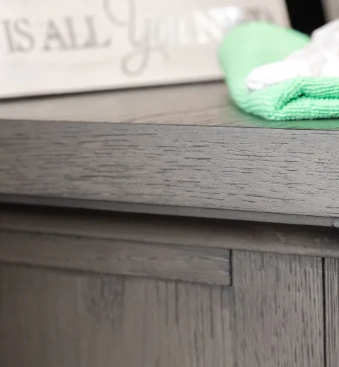 table with green cleaning cloth