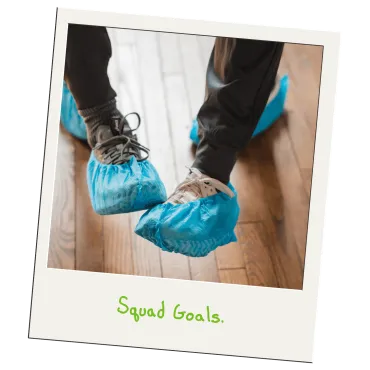 Merry Maids of Lancaster County cleaner wearing protective blue shoe covers to keep client floors clean.