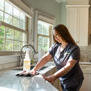 Team Member Cleaning Kitchen Counter
